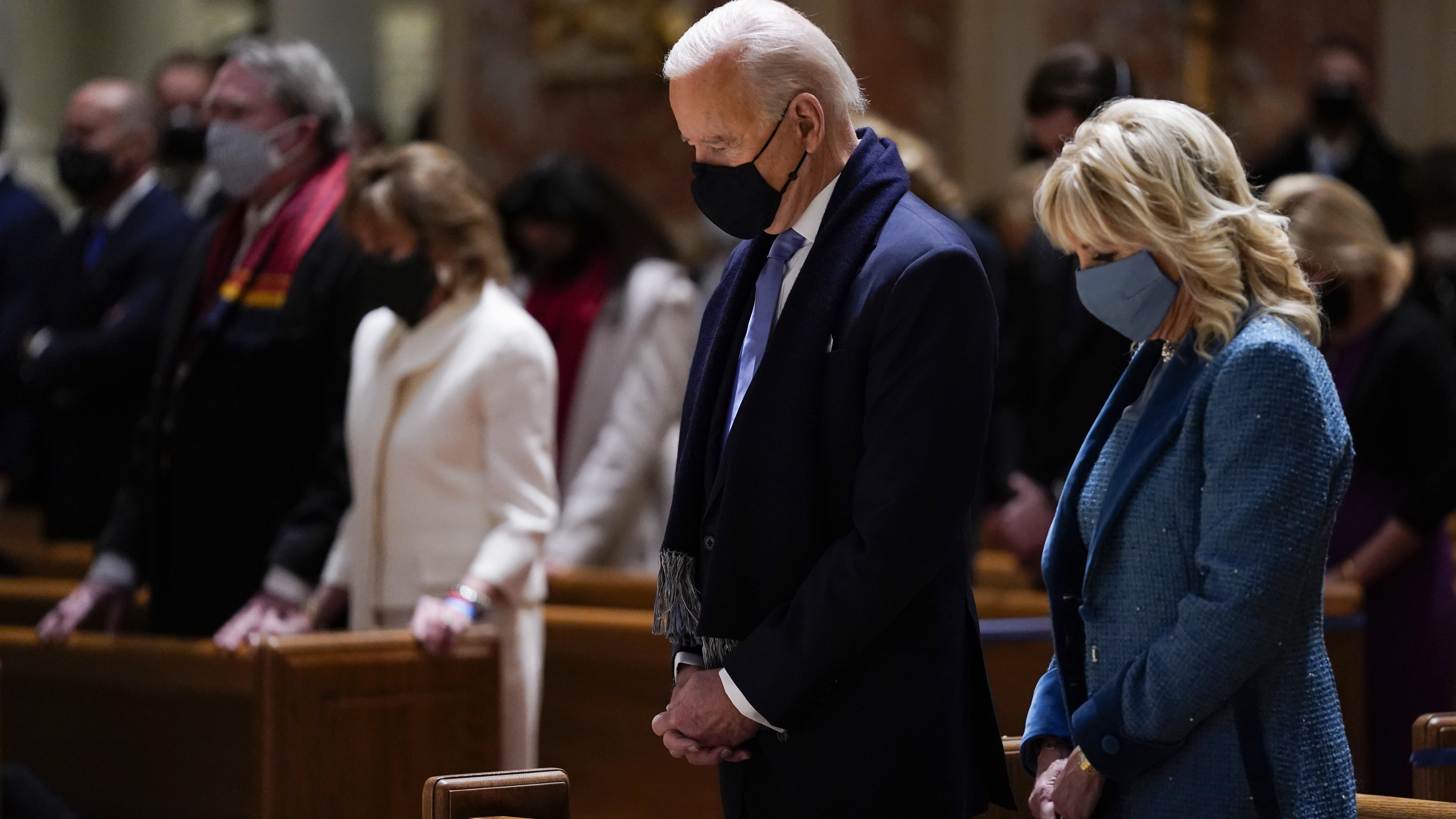President Joe Biden and his wife, Jill Biden, shown here on Jan. 20, 2021, attend Mass at the Cathedral of St. Matthew the Apostle during Inauguration Day ceremonies in Washington, D.C. CREDIT: Evan Vucci/AP