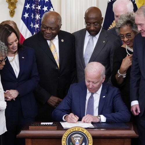 President Joe Biden signs the Juneteenth National Independence Day Act in the East Room of the White House on Thursday. CREDIT: Evan Vucci/AP