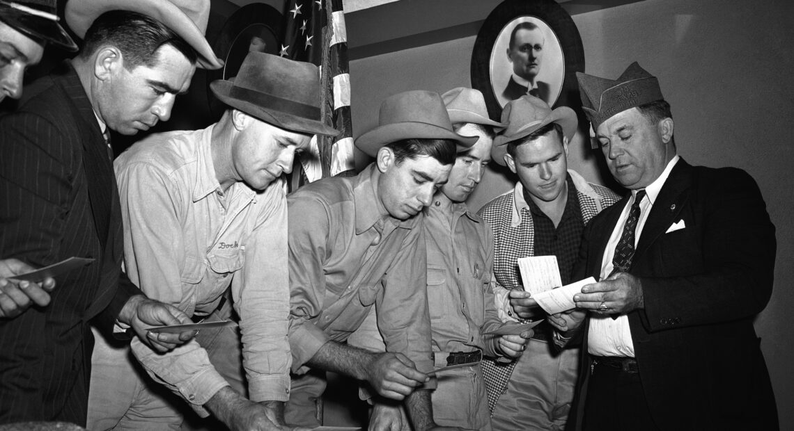 A group registers for military selective service at the state fair grounds in Dallas in 1940. The Supreme Court said Monday it would not hear a case challenging the rule that only men need to register for the draft. AP
