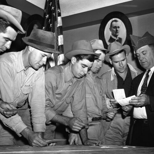 A group registers for military selective service at the state fair grounds in Dallas in 1940. The Supreme Court said Monday it would not hear a case challenging the rule that only men need to register for the draft. AP