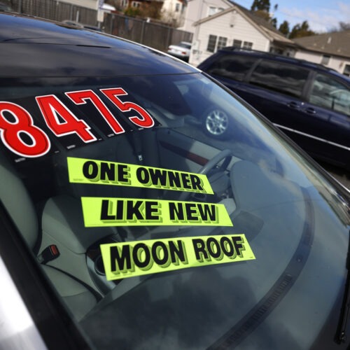 Used cars sit on the sales lot at Frank Bent's Wholesale Motors in El Cerrito, Calif., on March 15. Supply chain snarls and pent-up demand are driving up the prices of a lot of things, including new and used cars. CREDIT: Justin Sullivan/Getty Images