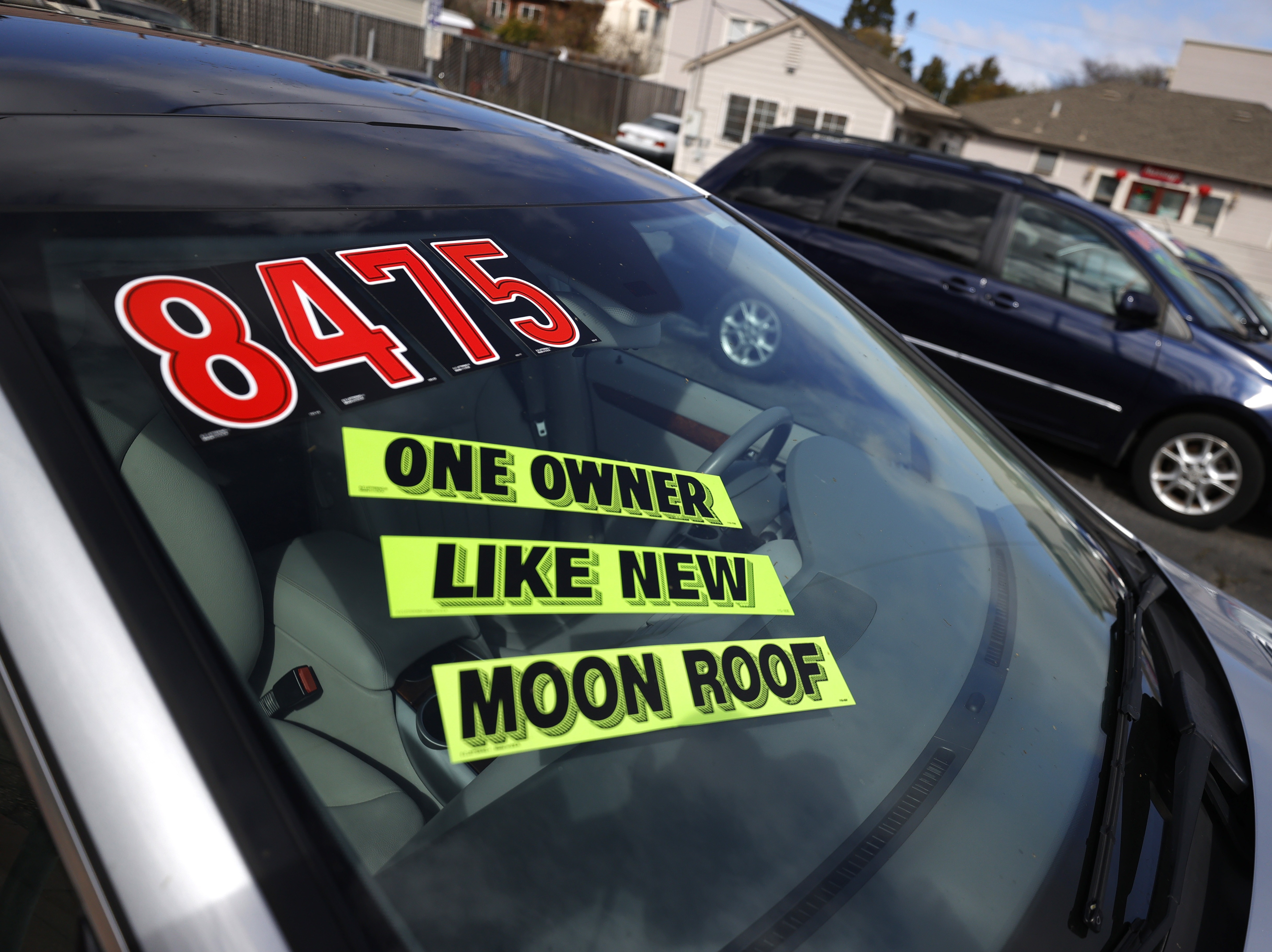 Used cars sit on the sales lot at Frank Bent's Wholesale Motors in El Cerrito, Calif., on March 15. Supply chain snarls and pent-up demand are driving up the prices of a lot of things, including new and used cars. CREDIT: Justin Sullivan/Getty Images