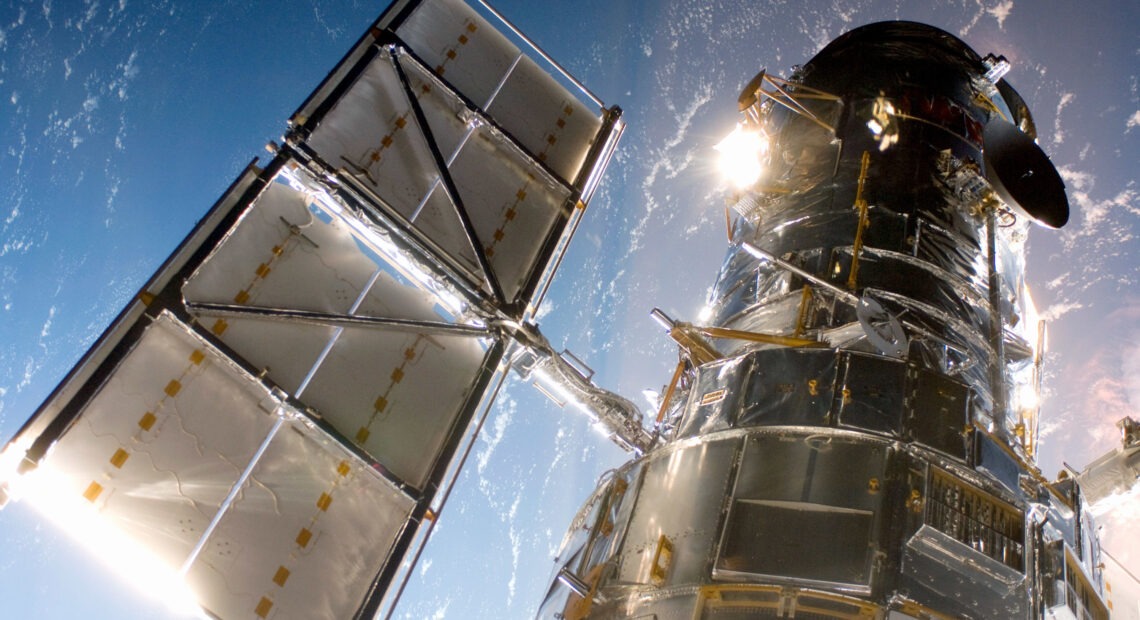 In this handout from NASA, the Hubble Space Telescope is grappled to Space Shuttle Atlantis STS-125 by the shuttle's Canadian-built remote manipulator system May 13, 2009 in Space. CREDIT: NASA/Getty Images