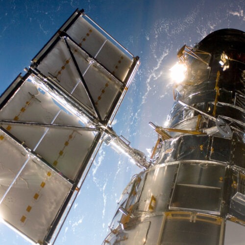 In this handout from NASA, the Hubble Space Telescope is grappled to Space Shuttle Atlantis STS-125 by the shuttle's Canadian-built remote manipulator system May 13, 2009 in Space. CREDIT: NASA/Getty Images