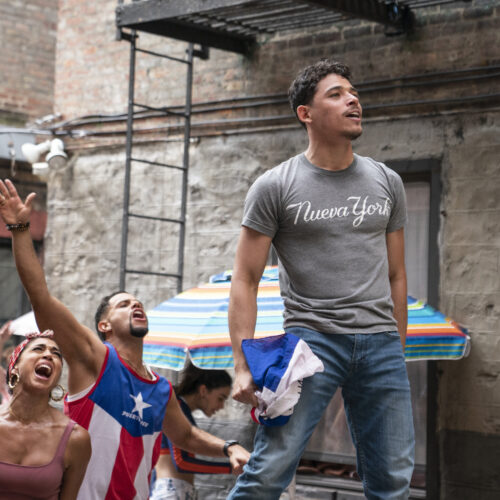 Usnavi (Anthony Ramos) runs a corner bodega and dreams of returning to the Dominican Republic in In the Heights. Courtesy of Warner Bros. Pictures