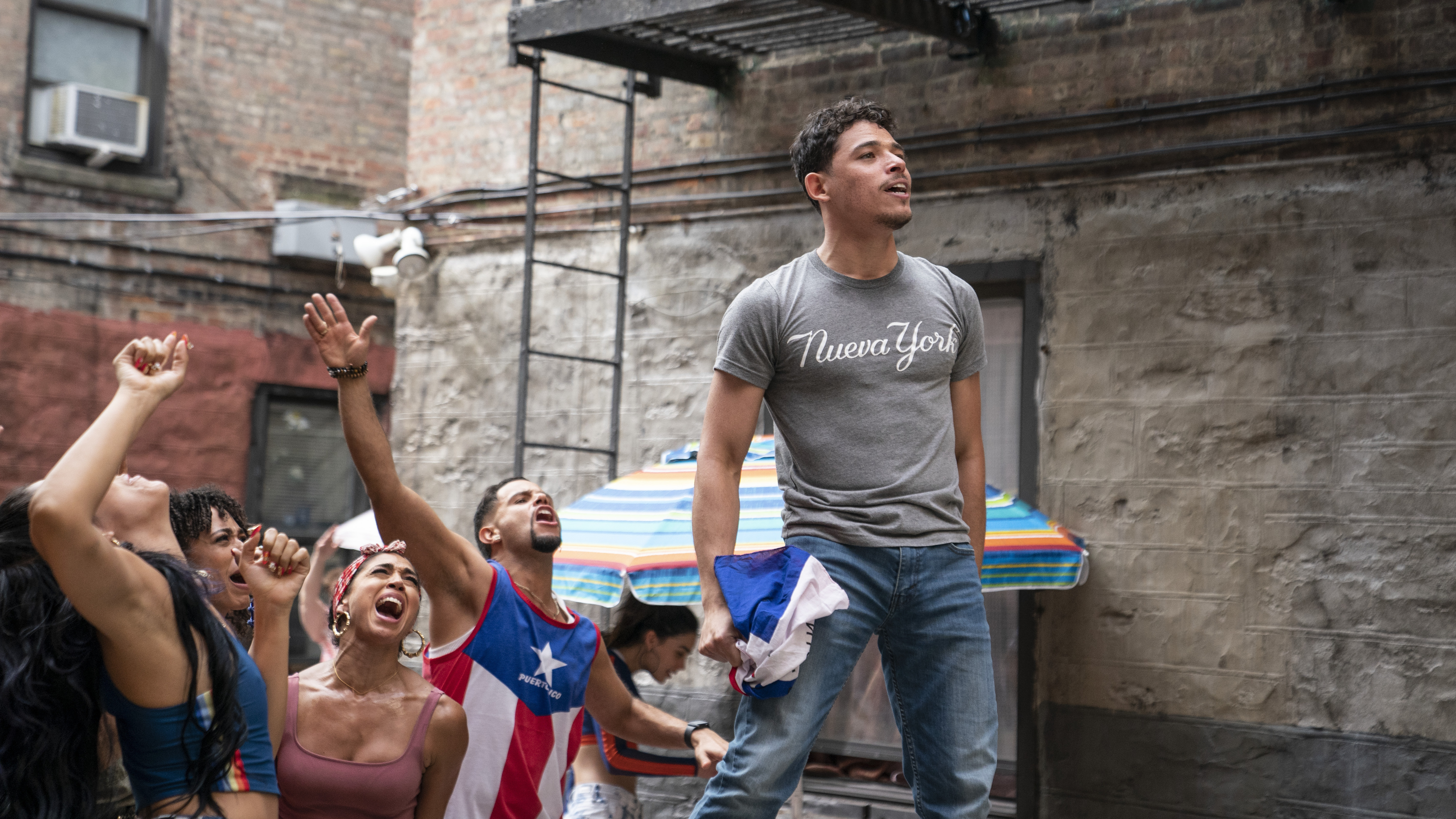 Usnavi (Anthony Ramos) runs a corner bodega and dreams of returning to the Dominican Republic in In the Heights. Courtesy of Warner Bros. Pictures