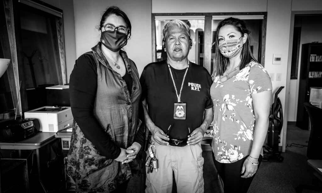 Photo of host Sueann Ramella, guest police chief Harold Scott and communications manager Kayeloni Scott after a recording of 'Traverse Talks.'