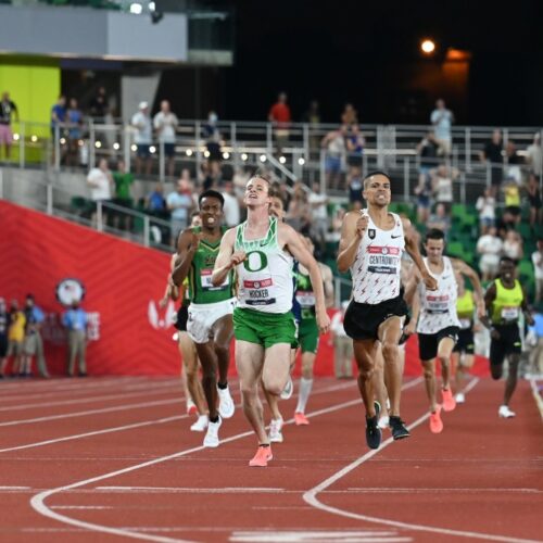 College athletes sprinting in a race.