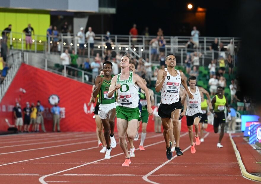 College athletes sprinting in a race.