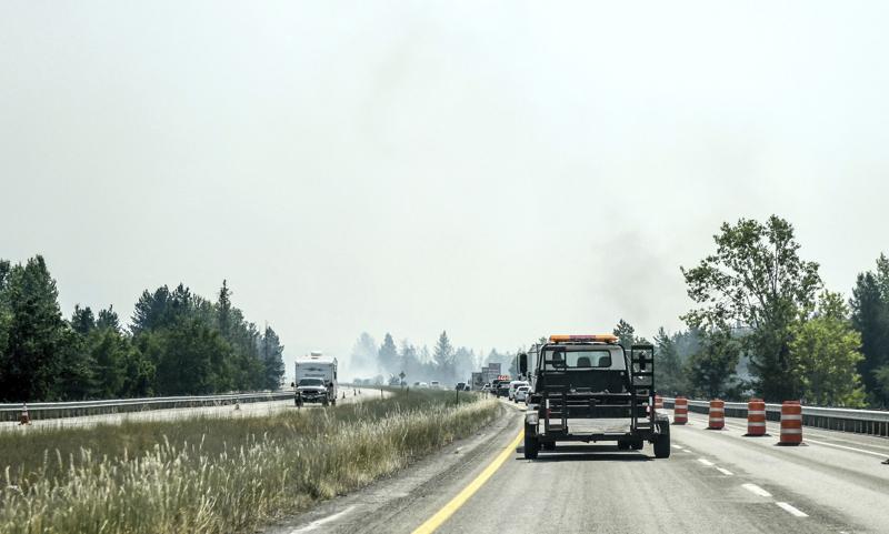 A section of I-90 is down to one lane due to heavy smoke near Cataldo, Idaho caused by fires in the area, July 7, 2021. CREDIT: Kathy Plonka/The Spokesman-Review via AP