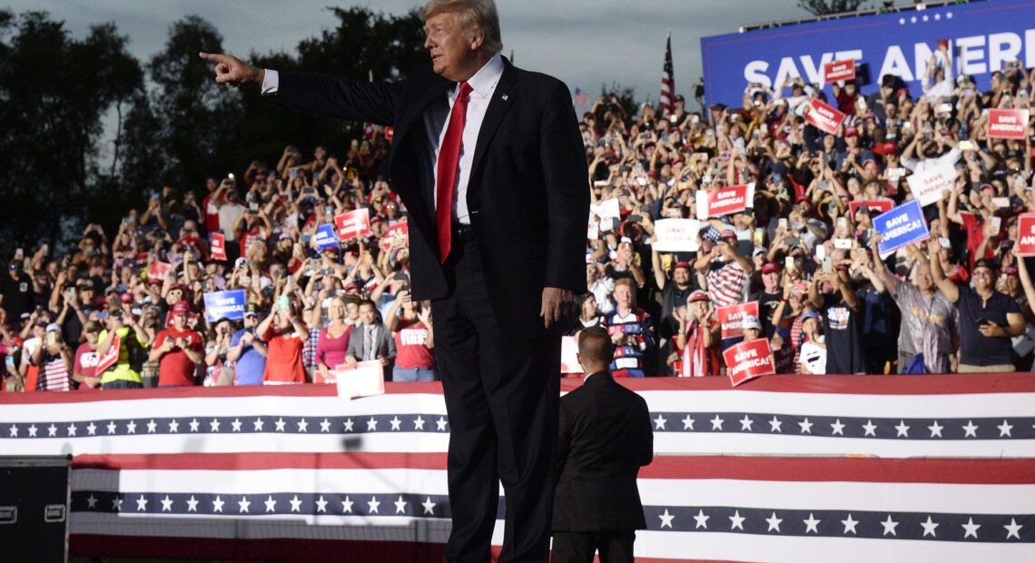 Former President Donald Trump has announced that he is suing three of the country's biggest tech companies: Facebook, Twitter and Google's YouTube. Here, he walks onstage during a rally on July 3 in Sarasota, Fla. CREDIT: Jason Behnken/AP