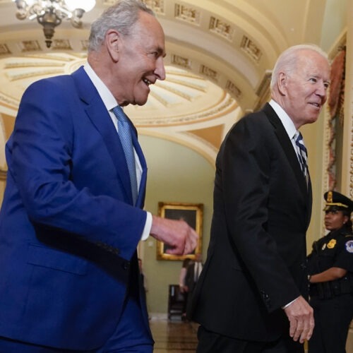 President Biden walks with Senate Majority Leader Chuck Schumer, D-N.Y., at the Capitol on Wednesday as he arrives to discuss the latest progress on his infrastructure agenda. CREDIT: Andrew Harnik/AP