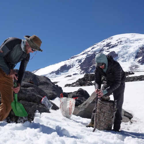 Photo of researchers on the icey mountain.