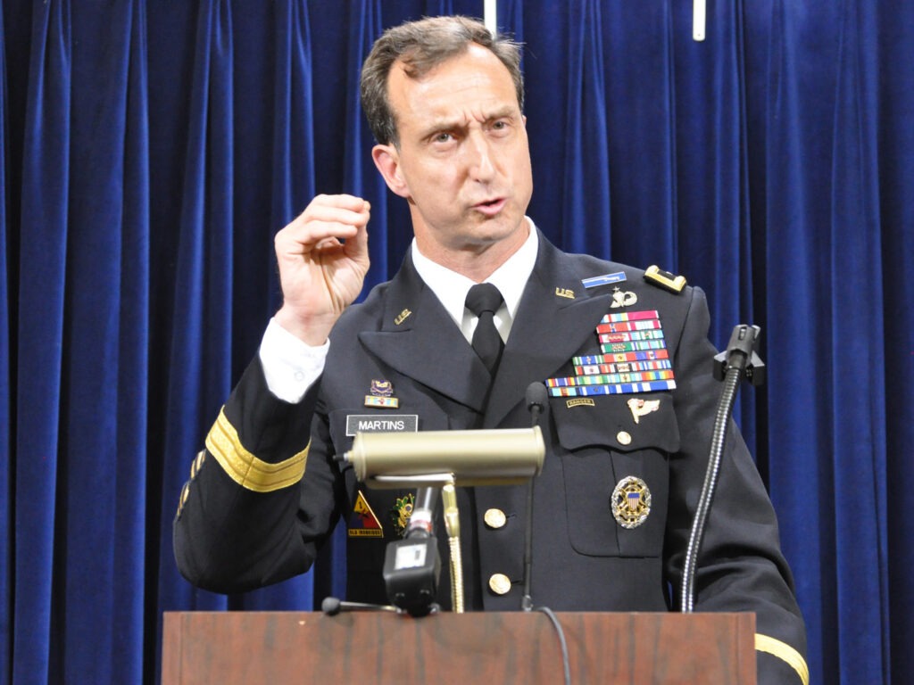Army Brig. Gen. Mark Martins, Guantánamo's chief prosecutor, addresses the media on Oct. 19, 2012, at the end of a week of pretrial hearings for the five alleged architects of the 9/11 attacks. Martins announced his retirement this week. Michelle Shephard/Toronto Star via Getty Images