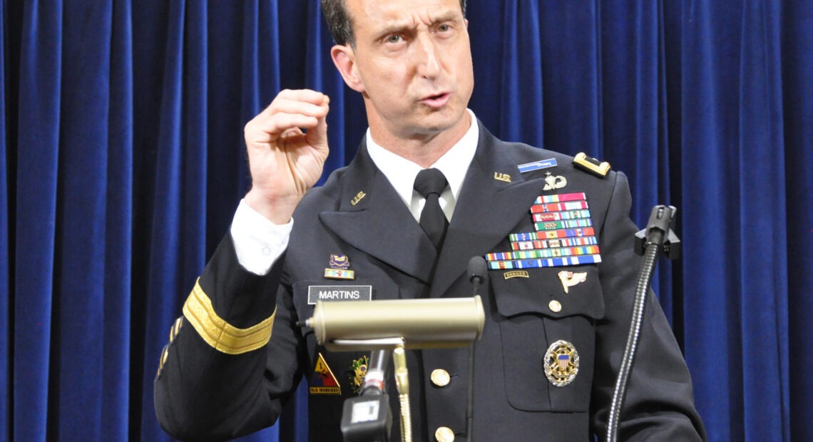 Army Brig. Gen. Mark Martins, Guantánamo's chief prosecutor, addresses the media on Oct. 19, 2012, at the end of a week of pretrial hearings for the five alleged architects of the 9/11 attacks. Martins announced his retirement this week. Michelle Shephard/Toronto Star via Getty Images