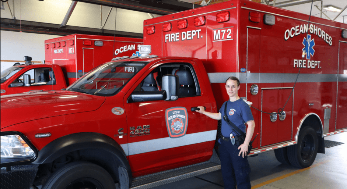 Ocean Shores firefighter/EMT Kara McDermott spends more time than usual behind to wheel of these ambulances as overwhelmed hospitals routinely divert incoming transports.