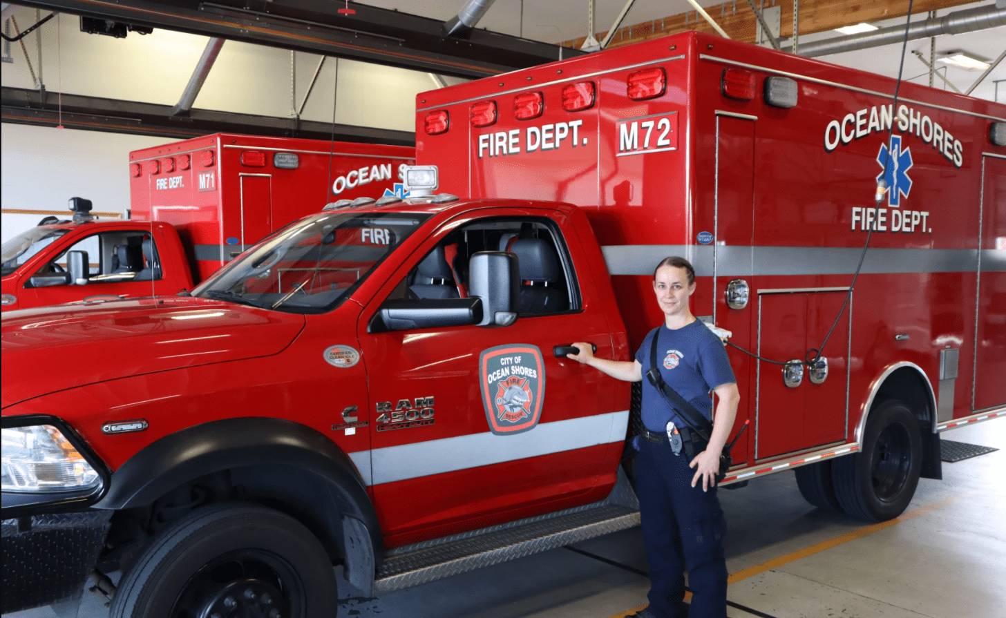 Ocean Shores firefighter/EMT Kara McDermott spends more time than usual behind to wheel of these ambulances as overwhelmed hospitals routinely divert incoming transports.