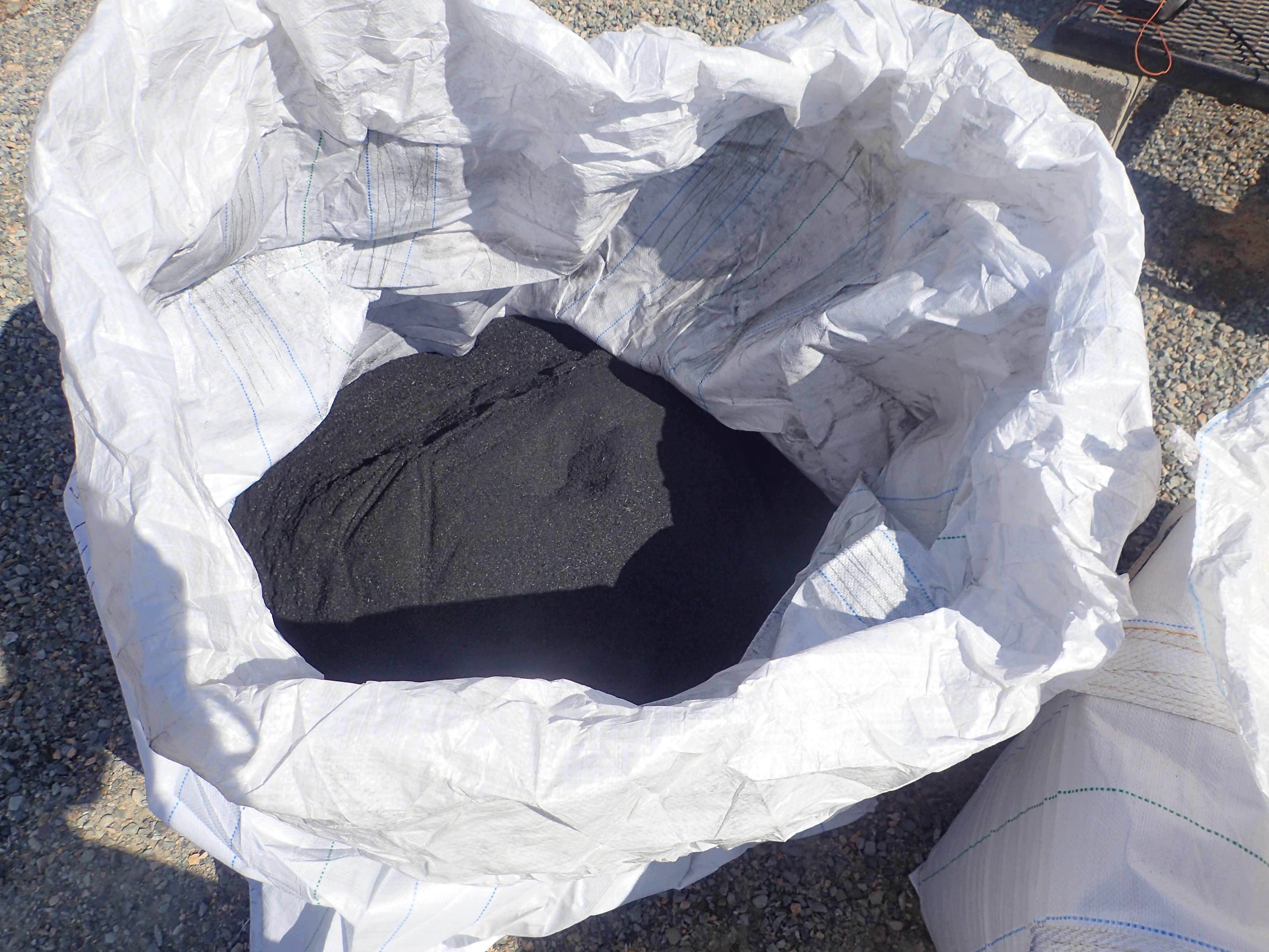 A white bag filled with biochar made by C6 Forest to Farm.
