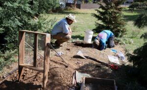 Keoni Diacamos and Gabby Rindenour examine historic brewery artifacts unearthed in what is now a private residence’s garden