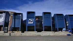 The Postal Service says the predicted slowdown is caused in part by the agency's decision to rely less on moving mail by air and more by ground transportation.