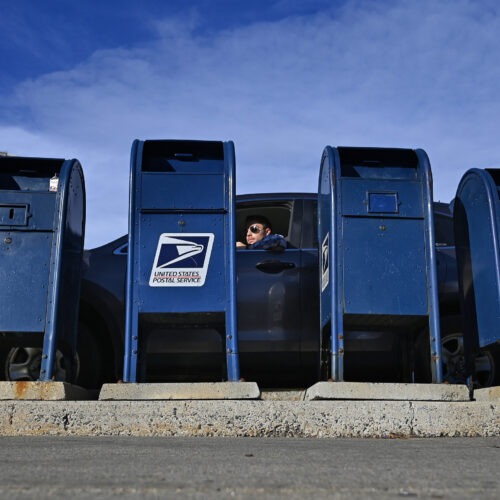 The Postal Service says the predicted slowdown is caused in part by the agency's decision to rely less on moving mail by air and more by ground transportation.