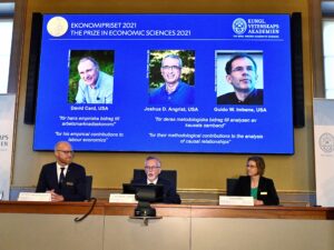 The Nobel Economics Prize committee members announce the winners of Nobel Memorial Prize in Economic Sciences on Monday. David Card, Joshua Angrist and Guido Imbens were given the award for their research of real-life events and policy changes.