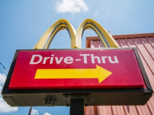 A McDonald's sign is shown on July 28 in Houston, Texas. One of the winners of the Nobel Prize in economics on Monday was cited for his work in studying the fast food industry to help determine how minimum wages impact employment.