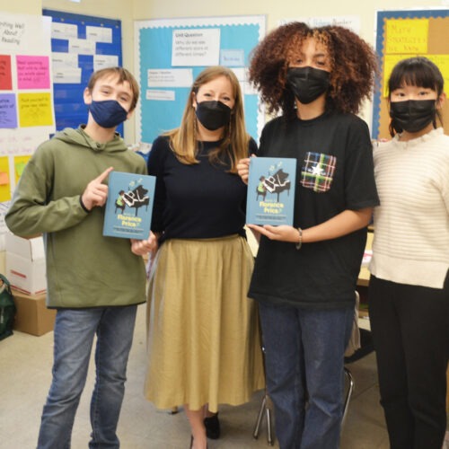 Three of the student authors of Who Is Florence Price? (left to right: Sebastián Núñez, Hazel Peebles and Sophia Shao), joined by their English teacher, Shannon Potts.