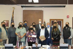 The Nez Perce Tribal Executive Committee stands with representatives from Ohio History Collection. Left to right: Shannon Wheeler, Casey Mitchell, Arthur Broncheau, Ryan Oatman, Liz Arthur-Attao, Shirley Allman, Burt Logan, Samuel Penney, Billy Friend, Rachel Edwards, Alex Wesaw, Quincy Ellenwood.