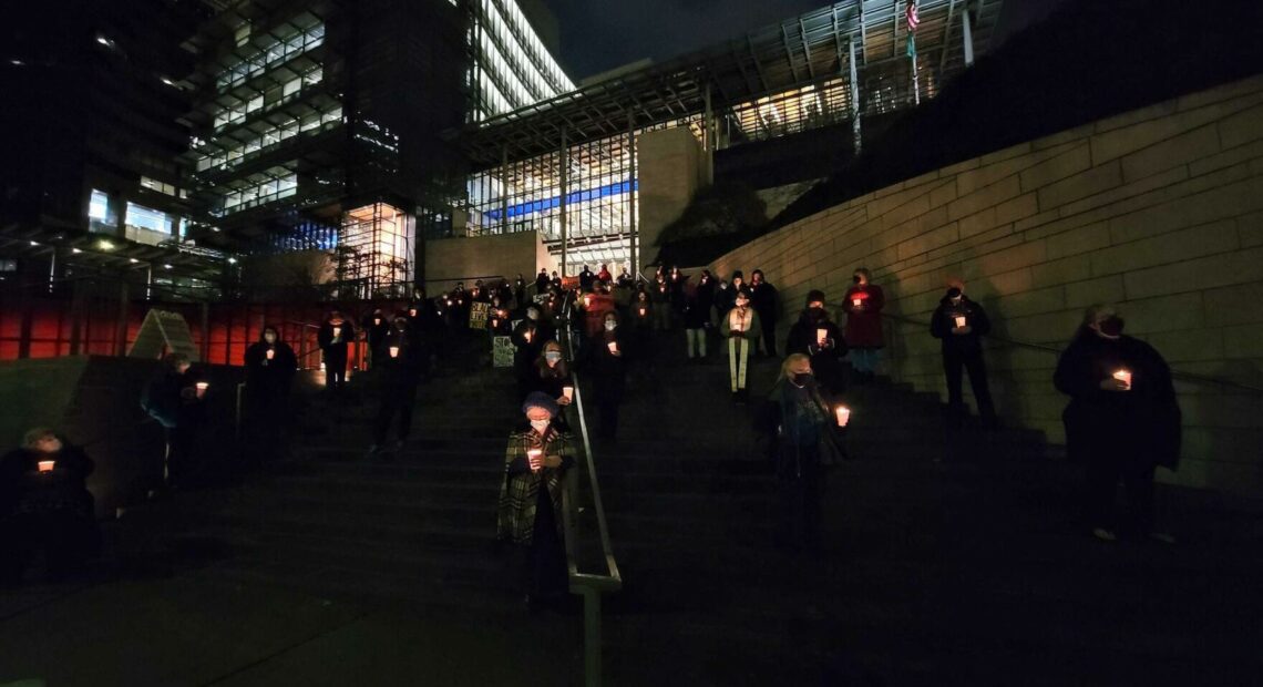 People gathered at Seattle City Hall on December 21, 2021 to remember homeless people who died in the past year.