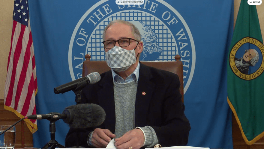 Washington Gov. Jay Inlsee with a mask on at a press conference