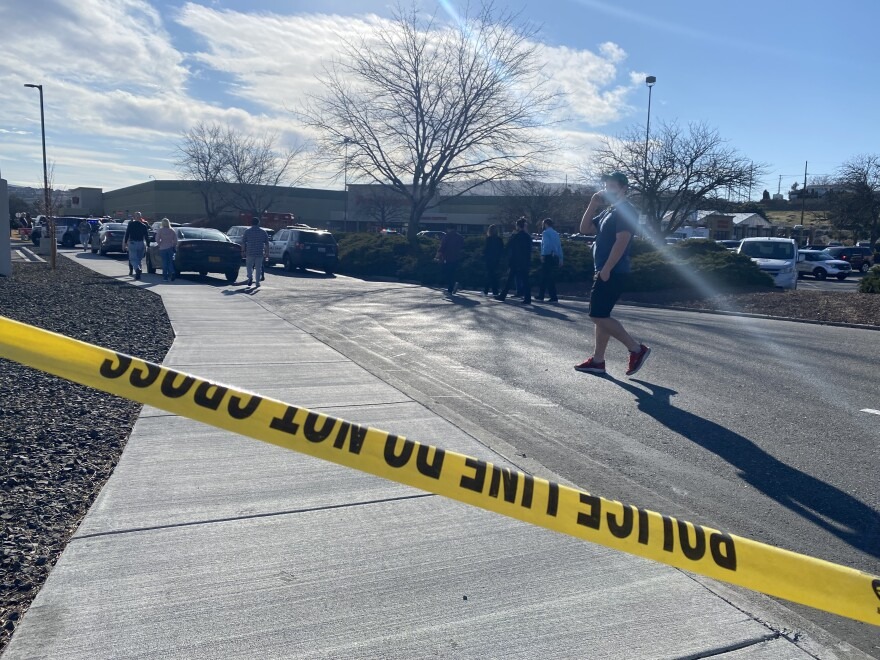 Crime scene tape blocks off the entrance to Richland's Fred Meyer. One person died and another was injured in a shooting at the store on Feb. 7.