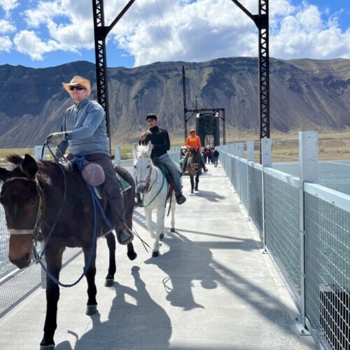 Riders cross the newly rebuilt Beverly Bridge on the Palouse to Cascades State Park Trail after a well-attended dedication event on April 8, 2022.