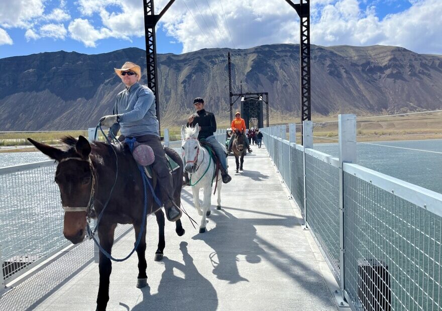 Riders cross the newly rebuilt Beverly Bridge on the Palouse to Cascades State Park Trail after a well-attended dedication event on April 8, 2022.