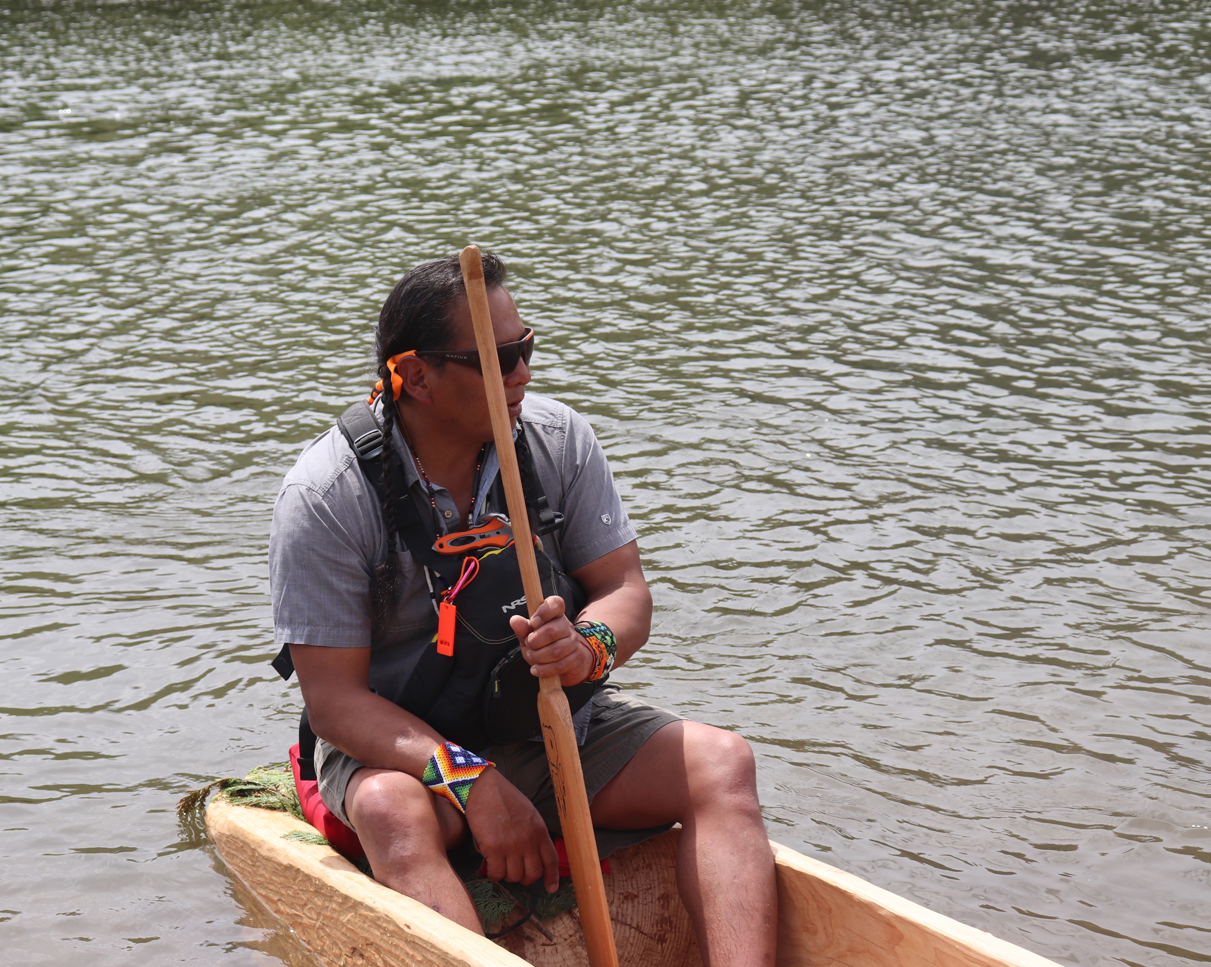 Gary Dorr sits inside the dugout canoe he made