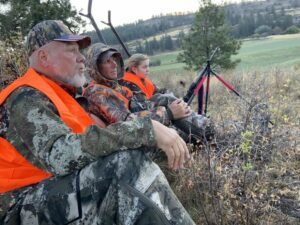 Mentors Bill Hinkle and Ryan Janke teach Julianne Hinkle, 16, how to hunt deer. The three had permission to hunt the deer, which were damaging agricultural crops near Kettle Falls, Washington.