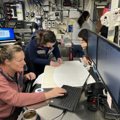 Scientists Jennifer Fisher and Clara Bird map out sampling stations along the Oregon and Washington coasts.