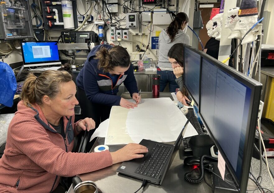 Scientists Jennifer Fisher and Clara Bird map out sampling stations along the Oregon and Washington coasts.