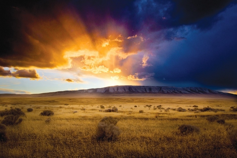 sunlight and clouds over sagebrush hill