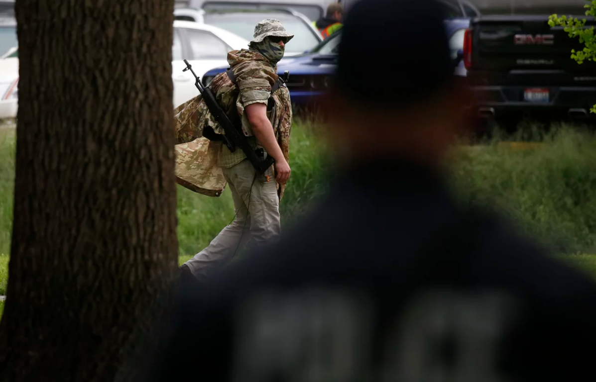 Man in fatigues with a rifle 