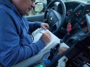 A man writing down information