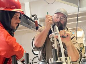 Vince Welton (right) and Colin Schmidt fix a CTD cable after it broke.