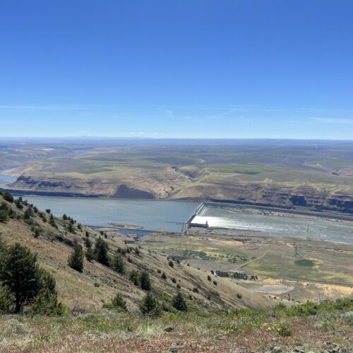 A view from the edge of the cliff where the Goldendale Energy Storage Project could be built. An underground tunnel would carry water from a upper reservoir to a reservoir down below. (Credit: Courtney Flatt / NW News Network)