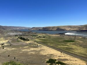 The lower reservoir would be built on a part of former aluminum smelter site, to the left of the trees.