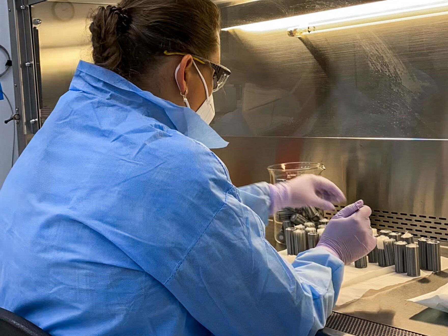 Pacific Northwest National Laboratory staff technician Yuliya Farris prepares sterile spaces used to hold soil in place for an experiment dubbed the Dynamics of the Microbiome in Space, known as DynaMoS. A SpaceX resupply mission will transport soil samples to the International Space Station, likely June 10.