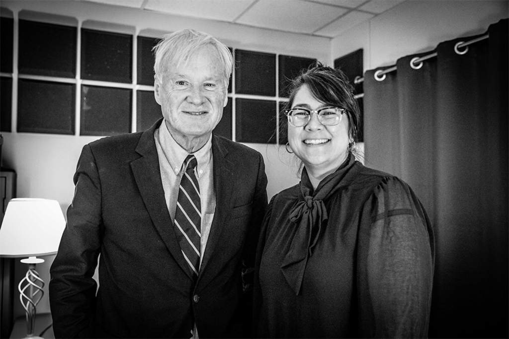 Chris Matthews, left, stands with Sueann Ramella, right, after the interview. They pose shoulder-to-shoulder, smiling at the camera.