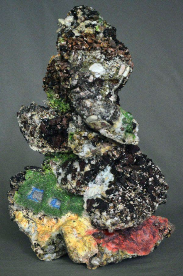 Sculpture artist Greg Pierce creates work from rocks he collects across the Pacific Northwest. His piece, "Shelter Two Sisters," was on display at the Seattle Art Fair.