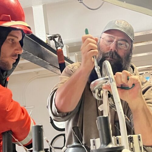 Vince Welton (right) and Colin Schmidt fix a CTD cable after it broke