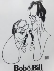 A caricature drawing of Bob and Bill holding microphones. 