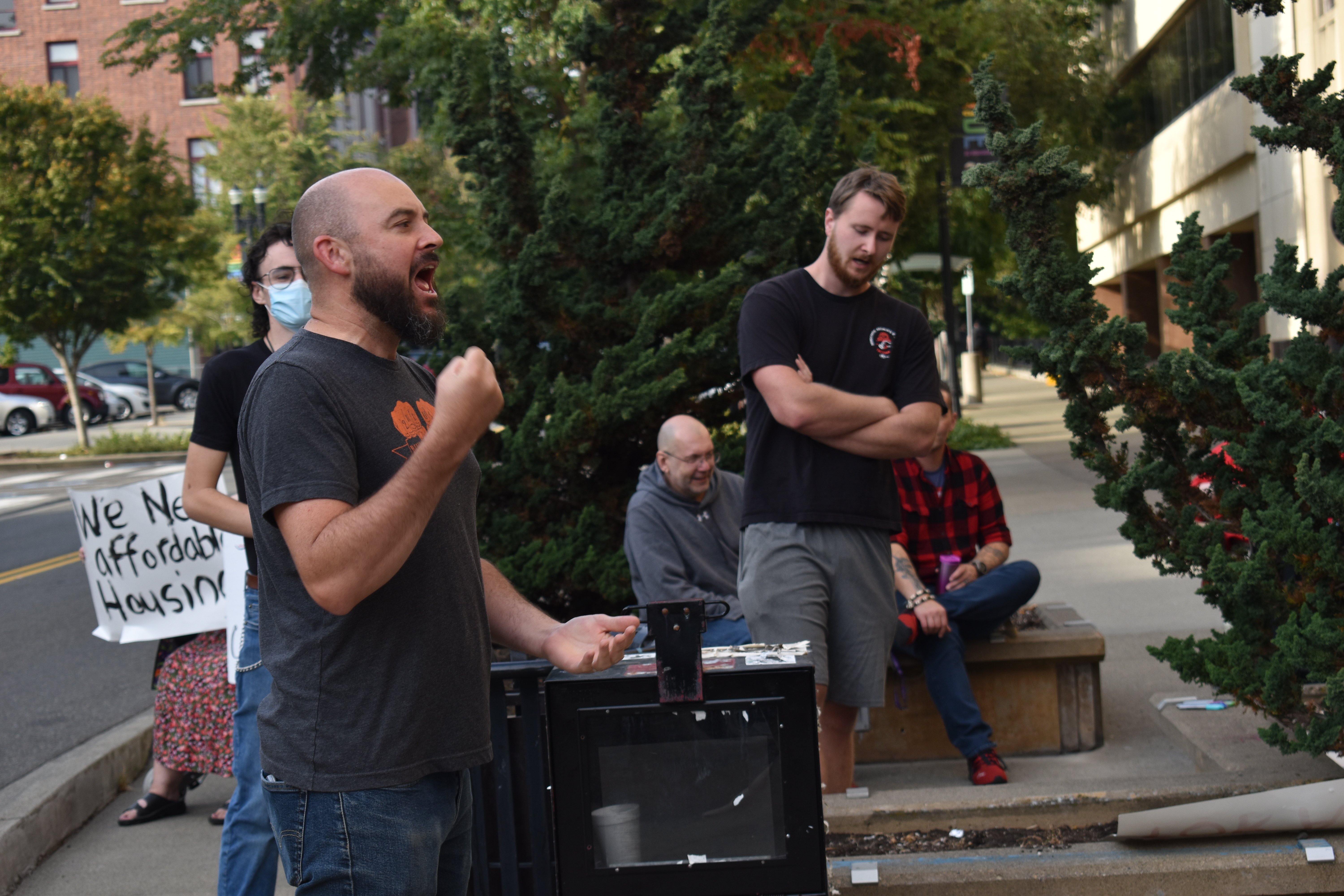 Ty Moore, with the Tacoma & Pierce County Democratic Socialists of America, spoke to the crowd on Tuesday about previous attempts to introduce camping bans. Photo by Lauren Gallup.
